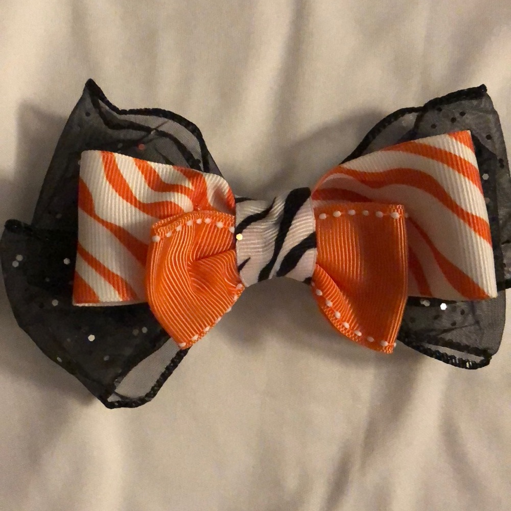 Black, orange, and zebra colored hair bow